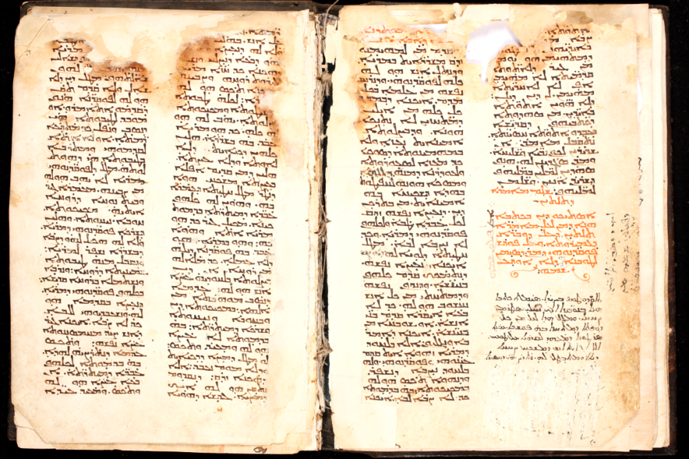 SMMJ 180, ff. 62v-63r. The end of the Book of Steps and the beginning of the Asceticon, with some damage at the top.